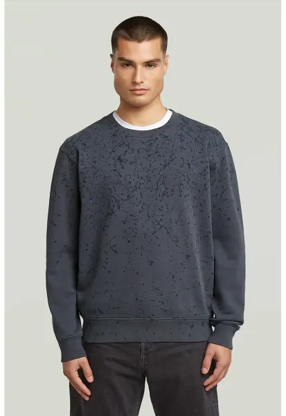 Bluza de trening din bumbac organic cu model cu pete de vopsea - Albastru inchis