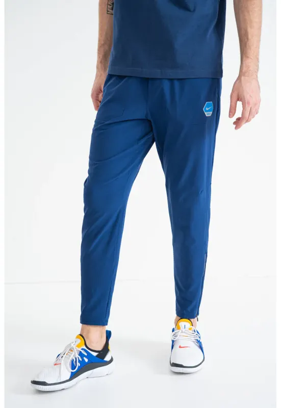 Pantaloni conici de trening cu logo - Albastru inchis