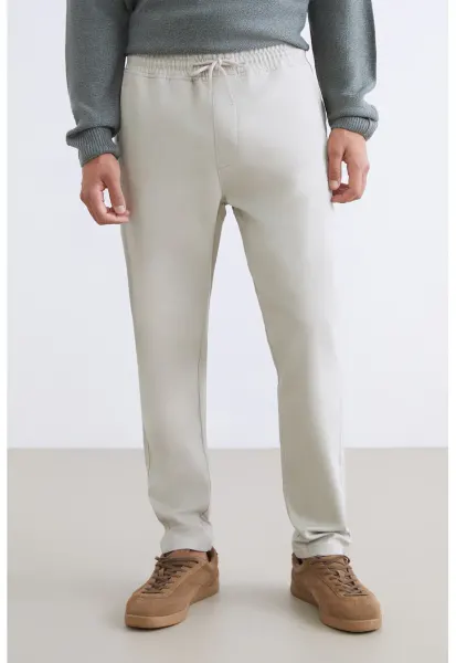 Pantaloni de trening cu snururi si model uni - Crem